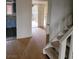 Entryway view with staircase, laminate floors, leading to kitchen and outdoor area at 2818 Calle Del Oro, Las Vegas, NV 89120