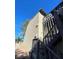 Exterior of building shows gray wooden stairs leading up to a second story, with stucco siding at 2818 Calle Del Oro, Las Vegas, NV 89120