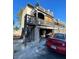 Exterior of a two story condo with weathered decks, visible unit number, and attached one car garage at 2818 Calle Del Oro, Las Vegas, NV 89120