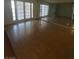 Bright living room with a large mirror wall and glass door at 2818 Calle Del Oro, Las Vegas, NV 89120