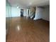 Open living room leading to staircase and hallway with a mirrored wall at 2818 Calle Del Oro, Las Vegas, NV 89120