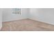 Bright bedroom with neutral carpet and a window at 2846 Cerulean Stars Ln # 1, Las Vegas, NV 89183