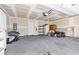Spacious unfinished garage with a concrete floor and overhead lighting at 2846 Cerulean Stars Ln # 1, Las Vegas, NV 89183