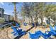 Charming community outdoor seating area with Adirondack chairs and beautiful trees providing a relaxing escape at 2846 Cerulean Stars Ln # 1, Las Vegas, NV 89183