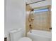Cozy bathroom featuring a shower-tub combo with neutral tiles and a window for natural light at 2908 Ferrand Ct, Henderson, NV 89044