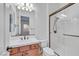 Bathroom featuring a single sink vanity, a mirror, a toilet, and a glass shower with bronze trim at 2908 Ferrand Ct, Henderson, NV 89044