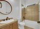 Bathroom featuring tiled shower/tub and vanity with oval mirror at 2908 Ferrand Ct, Henderson, NV 89044