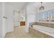 Bathroom features tile floors, soaking tub, and ample vanity space at 2908 Ferrand Ct, Henderson, NV 89044