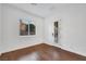 Bright bedroom featuring hardwood floors, a large window, and a door to the outside at 2908 Ferrand Ct, Henderson, NV 89044