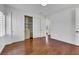 Bedroom with wood flooring, built-in closet system and views to the hallway at 2908 Ferrand Ct, Henderson, NV 89044