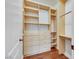 Walk-in closet features custom built-ins with shelving, drawers, and ample hanging space for storage at 2908 Ferrand Ct, Henderson, NV 89044
