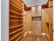 Walk-in closet with built in shelving and wood drawers at 2908 Ferrand Ct, Henderson, NV 89044