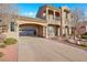 Lovely two-story home with a portico, balcony, attached two-car garage, and meticulously landscaped yard at 2908 Ferrand Ct, Henderson, NV 89044