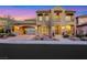 Stunning two-story home featuring an arched portico, balcony, and beautifully landscaped front yard at 2908 Ferrand Ct, Henderson, NV 89044