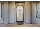 An arched entryway reveals tiled floors, elegant lighting, and a glimpse into the home's interior at 2908 Ferrand Ct, Henderson, NV 89044