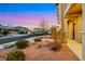 Charming landscaped front yard view, with rocks, shrubbery, and lighting, in a well-maintained neighborhood at 2908 Ferrand Ct, Henderson, NV 89044