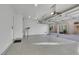 Three-car garage with epoxy flooring, providing ample space for parking and storage at 2908 Ferrand Ct, Henderson, NV 89044