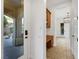 Hallway with views to the backyard fountain, as well as built-in shelves and drawers at 2908 Ferrand Ct, Henderson, NV 89044