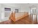 Upstairs hallway with wood flooring and views to the staircase and downstairs at 2908 Ferrand Ct, Henderson, NV 89044