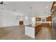 Open kitchen layout with a center island, fireplace and stainless steel appliances at 2908 Ferrand Ct, Henderson, NV 89044