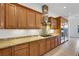 Chef's kitchen showcases custom wood cabinetry, granite counters, and stainless steel appliances at 2908 Ferrand Ct, Henderson, NV 89044