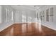 Bright living room with hardwood floors and plantation shutters bathed in sunlight at 2908 Ferrand Ct, Henderson, NV 89044