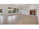 Inviting living room with lots of natural light from the large windows and stone fireplace at 2908 Ferrand Ct, Henderson, NV 89044