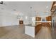 Open floor plan with a seamless flow from the kitchen to the living room featuring a fireplace at 2908 Ferrand Ct, Henderson, NV 89044