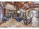 Beautiful lobby featuring a stone fireplace, wood beams, ample seating and large windows for natural light at 2908 Ferrand Ct, Henderson, NV 89044