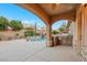 Outdoor kitchen and entertaining area, with built in barbeque, a pool, and a spa at 2908 Ferrand Ct, Henderson, NV 89044