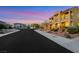 Inviting street view of a two-story house featuring desert landscaping, architectural details, and exterior lighting at 2908 Ferrand Ct, Henderson, NV 89044