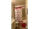 Bathroom featuring tiled walls, decorative shower curtain and vanity with countertop at 2916 Karen Ave, Las Vegas, NV 89121