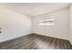 Empty bedroom features wood-look flooring and natural light at 2916 Karen Ave, Las Vegas, NV 89121