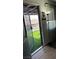 Inviting entryway with view of backyard featuring security door and tiled flooring at 2916 Karen Ave, Las Vegas, NV 89121