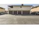 A building with an upstairs balcony and garage doors below shows parking and space for living at 2916 Karen Ave, Las Vegas, NV 89121