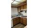 Functional kitchen with laminate countertops, wooden cabinets and double sink at 2916 Karen Ave, Las Vegas, NV 89121