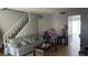 Inviting living room featuring a comfortable sofa and view to stairs and connecting rooms at 2916 Karen Ave, Las Vegas, NV 89121