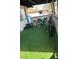Small patio space perfect for seating with artificial turf and balcony at 2916 Karen Ave, Las Vegas, NV 89121