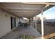 Covered patio with outdoor dining set perfect for entertaining in the spacious backyard at 301 Falcon Ln, Las Vegas, NV 89107