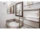Bathroom featuring a granite countertop vanity, modern lighting, and decorative shelving at 301 Falcon Ln, Las Vegas, NV 89107