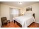 Bright bedroom with a view, featuring a cozy bed and a chair, offering a comfortable living space at 301 Falcon Ln, Las Vegas, NV 89107