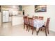 Bright dining room with modern finishes adjacent to the open kitchen at 301 Falcon Ln, Las Vegas, NV 89107