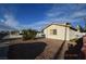 Cozy home featuring desert landscaping and a bright, sunny sky at 301 Falcon Ln, Las Vegas, NV 89107