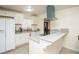 Bright kitchen featuring white cabinetry, granite countertops, and stainless steel appliances at 301 Falcon Ln, Las Vegas, NV 89107