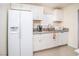 Bright kitchen featuring white cabinetry, granite countertops, and stainless steel appliances at 301 Falcon Ln, Las Vegas, NV 89107