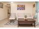 Bright living room with comfortable seating and tile flooring at 301 Falcon Ln, Las Vegas, NV 89107
