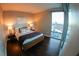Inviting bedroom showcasing a cozy bed with a large window framing stunning city vistas at 322 Karen Ave # 3407, Las Vegas, NV 89109