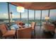Contemporary dining area offering stunning cityscape views with a modern table set for an elegant meal at 322 Karen Ave # 3407, Las Vegas, NV 89109