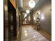 Elegant elevator lobby featuring marble floors, mirrored walls, modern lighting, and sophisticated decor elements at 322 Karen Ave # 3407, Las Vegas, NV 89109