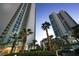 Luxurious high-rise condo complex surrounded by lush greenery and tropical palm trees at 322 Karen Ave # 3407, Las Vegas, NV 89109